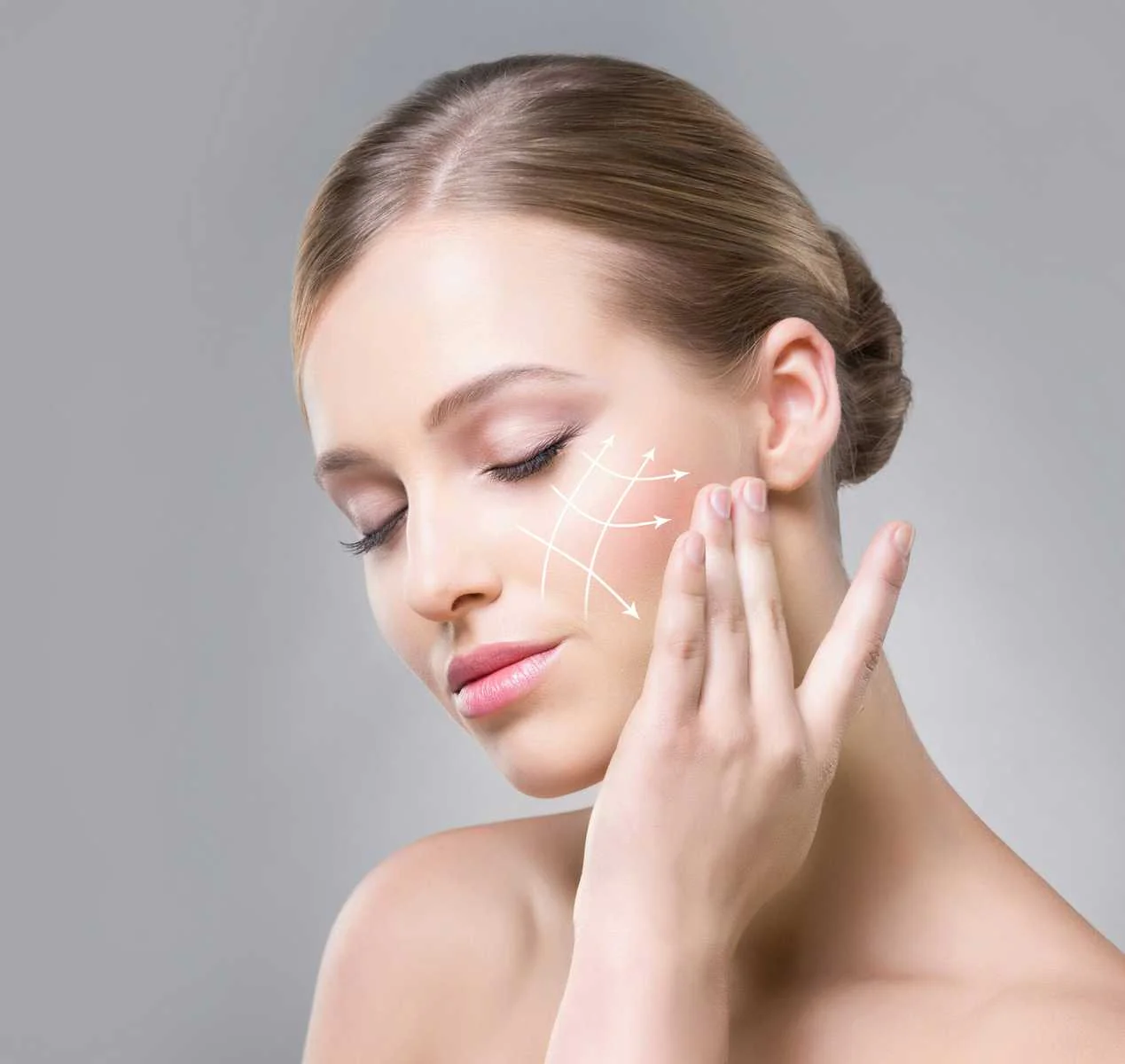 Woman applying skincare product after receiving skinvive treatment at Eluxir MD in Chesapeake, VA